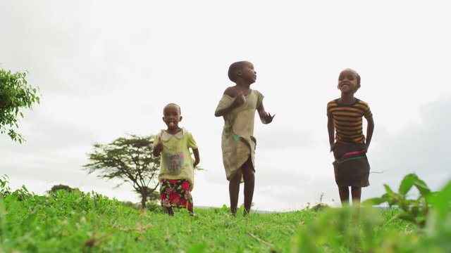 Maasai children jumping happily