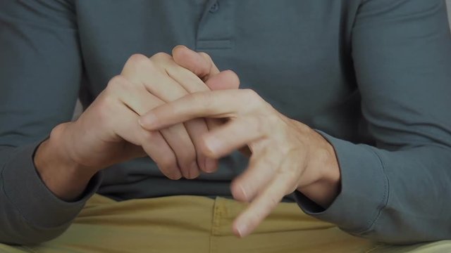 The man is nervous. Hands of a nervous person.