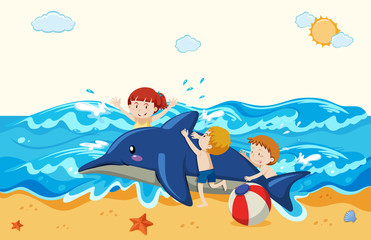 Kids and inflatable dolphin at the beach