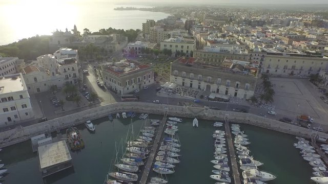 Panning shot aerial, docks in Trani