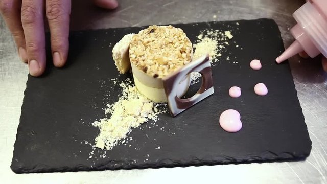 Close up, chef plates fancy dessert