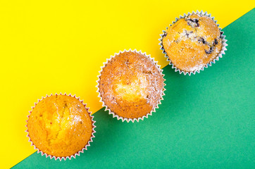 Tasty fresh cupcakes on bright background