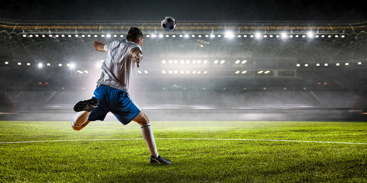 Soccer player at stadium. Mixed media