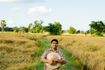 Brown Skin Farmer And His Rice Field