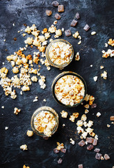 Caramel sweet popcorn, dark background, top view
