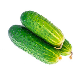 Three fresh green cucumbers isolated on white background