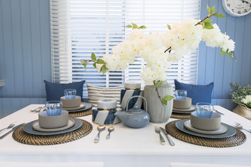 blue and rustic style dining table set at home