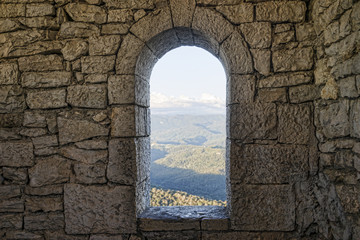 Window in a stone wall - Powered by Adobe