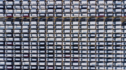 Crowded new cars parked in rows