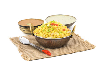 Indian Breakfast Dish Poha Also Know as Pohe or Aalu poha made up of Beaten Rice or Flattened Rice. The rice flakes are lightly fried in oil with mustard, chilly, onion, curry leaves and turmeric