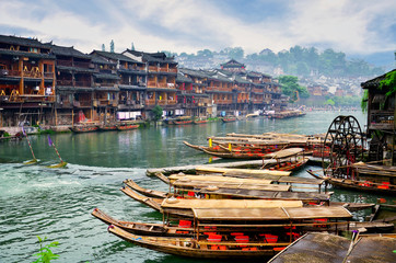 Fototapeta na wymiar HUNAN, CHINA - JUNE 16, 2014 : Old houses in Fenghuang county in Hunan, China. The ancient town of Fenghuang was added to the UNESCO World Heritage Tentative List in the Cultural category.