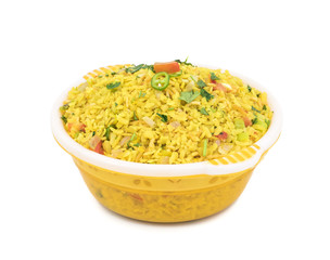 Indian Breakfast Dish Poha Also Know as Pohe or Aalu poha made up of Beaten Rice or Flattened Rice. The rice flakes are lightly fried in oil with mustard, chilly, onion, curry leaves and turmeric