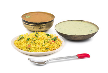 Indian Breakfast Dish Poha Also Know as Pohe or Aalu poha made up of Beaten Rice or Flattened Rice. The rice flakes are lightly fried in oil with mustard, chilly, onion, curry leaves and turmeric