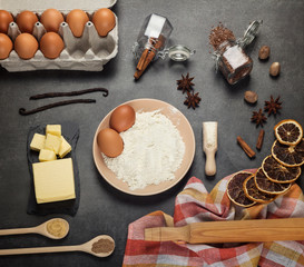 A set of products for the preparation of dough, spices, dry citrus on work surface