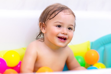 Sweet child taking bath