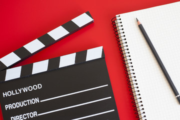 film clapper on red background