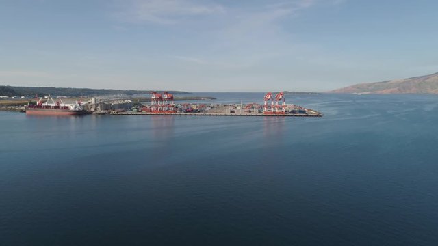 Sea cargo port with cranes, docks, containers in Subic Bay. Philippines,Luzon. Aerial view: cargo port and container terminal.