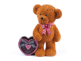 Cute bear holding a red heart on white background