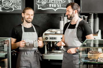 Fototapeta na wymiar Two baristas in the coffee shop