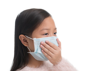 Asian kid girl age 7 years with protection mask against flu virus