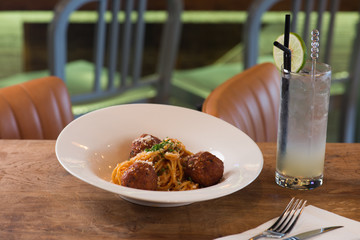 Spaghetti pasta with meatballs in restaurant
