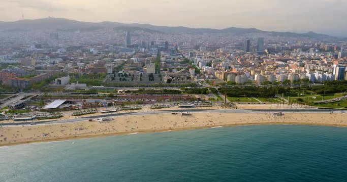 Aerial view of Barcelona city skyline and the beach, Spain. Late afternoon light