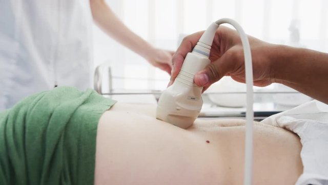 Doctor performing an ultrasound examination