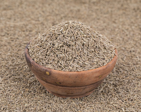 Pile of Dried Cumin Seeds Also Know as Caraway, jira or jeera Its seeds are used in the cuisines of many different cultures