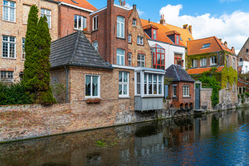 Fototapeta na wymiar View of a canal and old colorful buildings in Bruges, Belgium