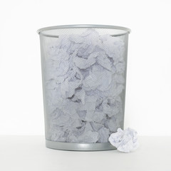 SILVER METAL WASTE PAPER LITTER BIN ON WHITE BACKGROUND