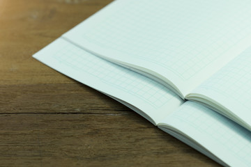 Stack blank notebook on wooden table for learning Japanese language writing words.