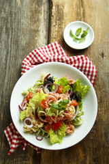 Homemade pasta salad with cherry tomatoes and olives