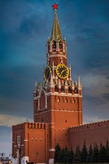 Fototapeta na wymiar Spasskaya Tower on Red Square, Moscow, Russia at sunset with glowing red star on the top