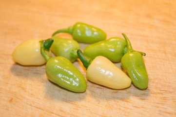 Habanero White chili pepper pods on wooden cutting board