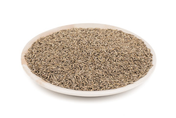 Pile of Dried Cumin Seeds Also know as caraway, jira or jeera seeds used in oriental cuisine isolated on white Background
