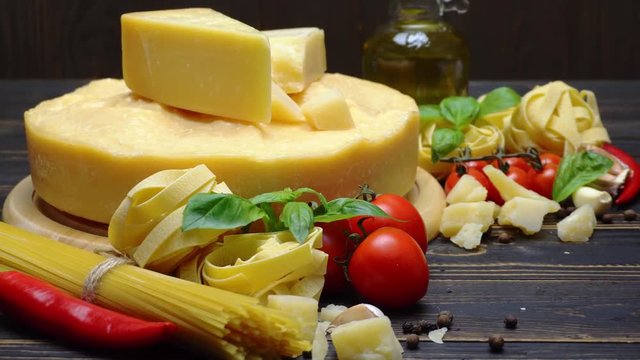 Video of Traditional italian food - parmesan cheese, pasta, tomato and olive oil