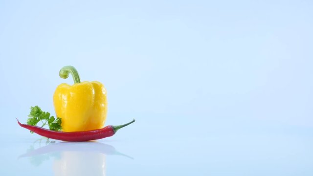 yellow papper and chili, lie on white background