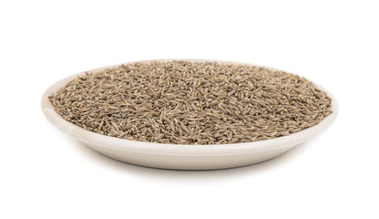 Pile of Dried Cumin Seeds Also know as caraway, jira or jeera seeds used in oriental cuisine isolated on white Background