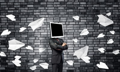 Businessman with monitor instead of head.