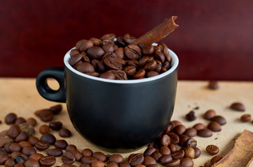 coffee beans, black Cup and cinnamon