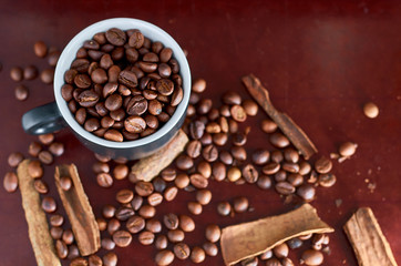 coffee beans, black Cup and cinnamon