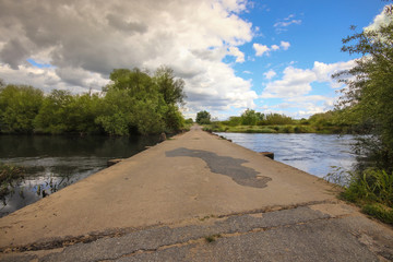 Bridge across a river surrounded by green trees. Alentejo in Portugal