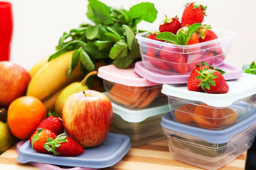 Filled plastic containers to save food and fruits fresh