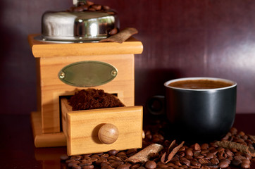 coffee beans, black Cup, coffee grinder and cinnamon