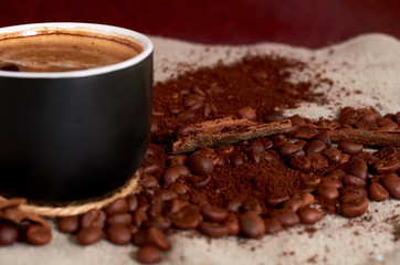 coffee beans, black Cup, and cinnamon