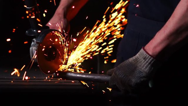 industrial engineer working on cutting a metal and steel with compound mitre saw with sharp, circular blade