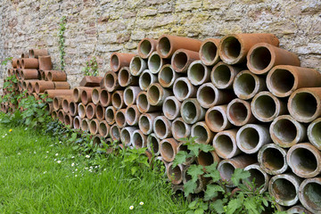 Stack of terracotta tube planters for gardening