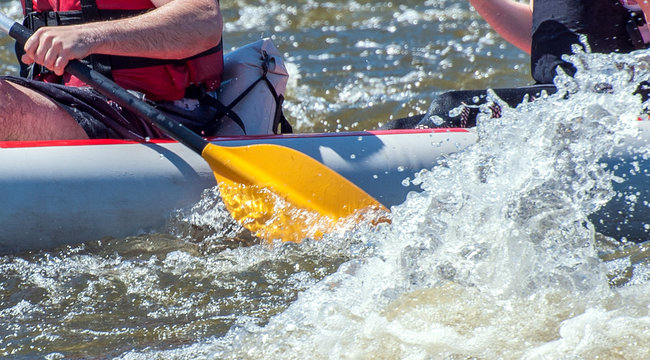 Rafting, Kayaking. Close-up View Of Oars With Splashing Water. Extreme Sport.