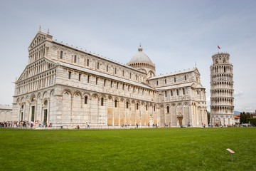 Fototapeta premium Pisa Cathedral, Roman Catholic cathedral dedicated to the Assumption of the Virgin Mary and the Leaning Tower of Pisa, bell tower of cathedral in Pisa, Italy.