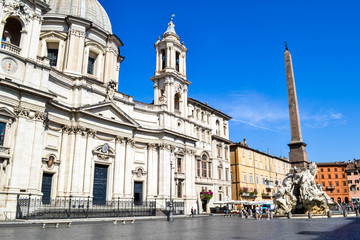 Fototapeta na wymiar Sant'Agnese in Agone church from Piazza Navona, Rome, Italy, with egyptian obelisk at the right